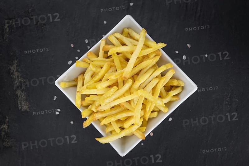 Portion of fresh made French Fries (close-up shot, selective focus)