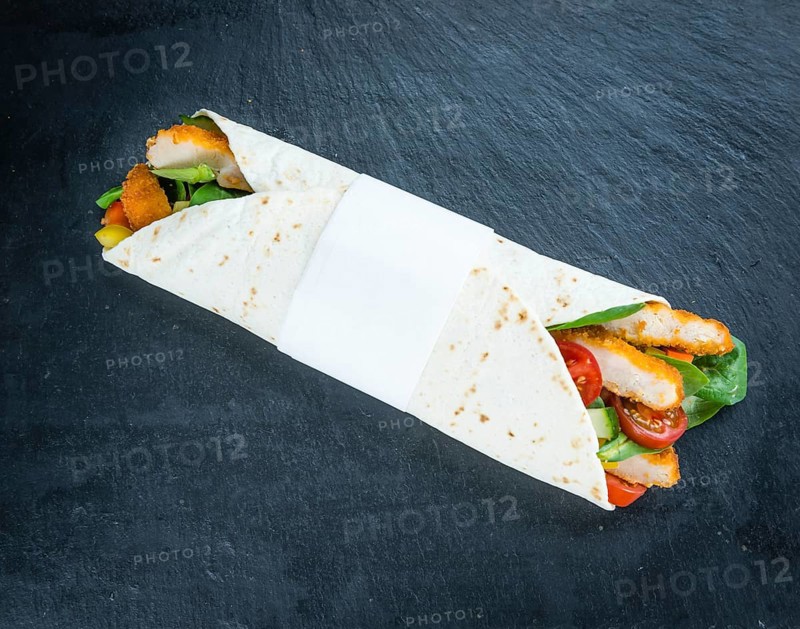 Slate slab with Chicken Wraps as detailed close-up shot (selective focus)