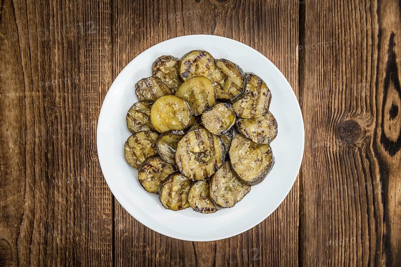 Homemade Antipasti (Grilled Zucchinis) on vintage background (selective focus, close-up shot)