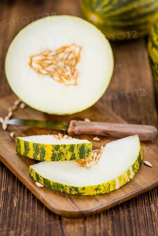 Portion of fresh Futuro Melons (close-up shot, selective focus)