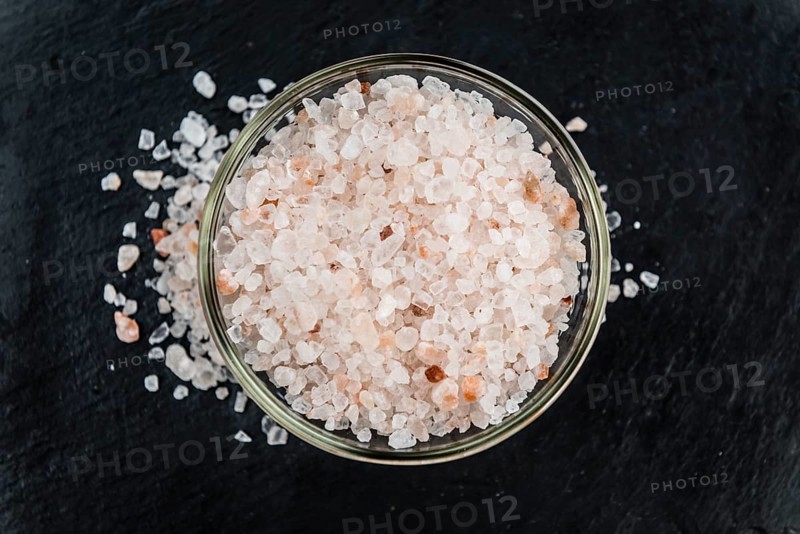Portion of Himalayan Salt on a rustic slate slab (selective focus, close-up shot)