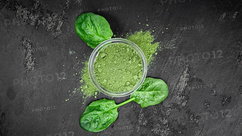 Freshly made green spinach powder (detailed close up shot, selective focus)