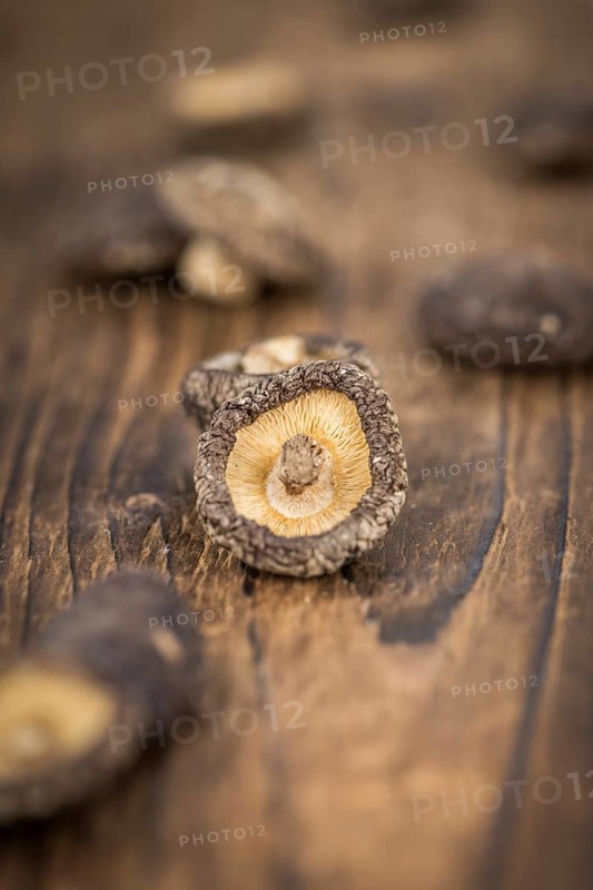 Dried Shiitake on a vintage background as detailed close-up shot, selective focus
