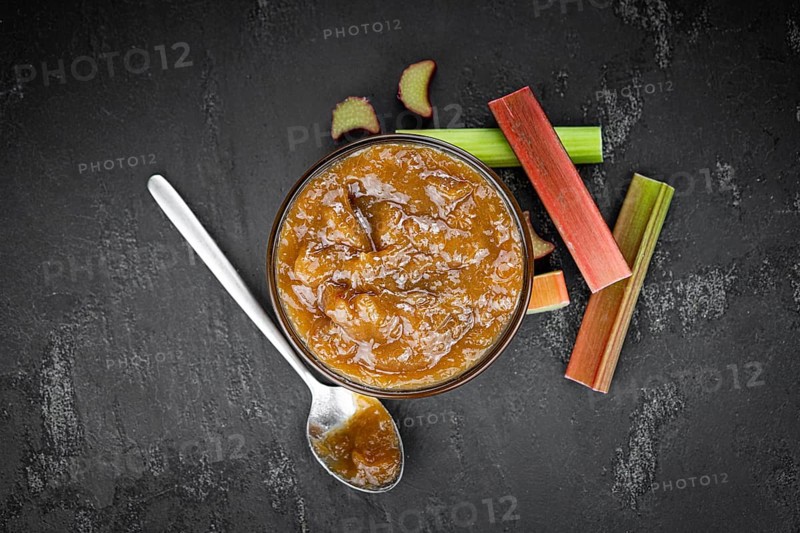 Homemade Rhubarb Jam on rustic background (close up shot, selective focus)
