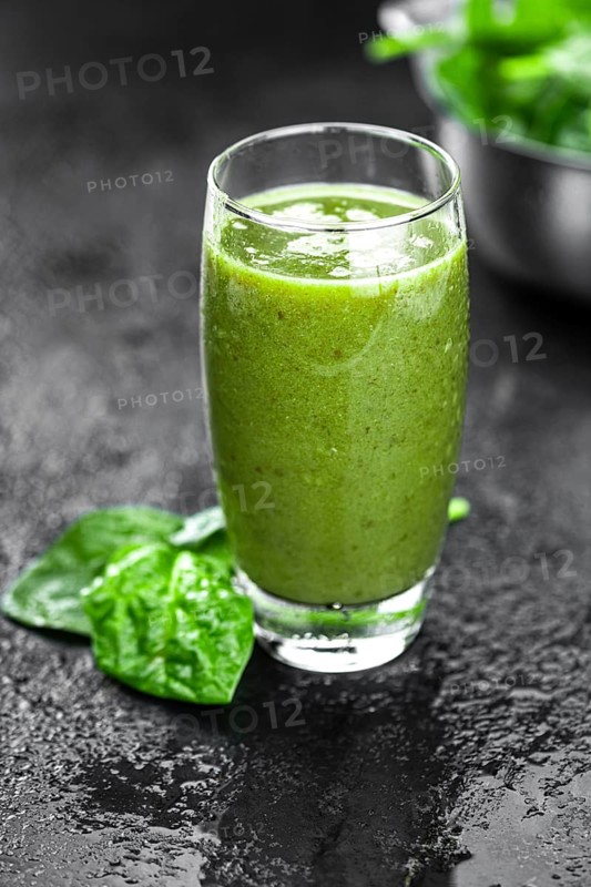 Homemade spinach smoothie (detailed close up shot, selective focus)