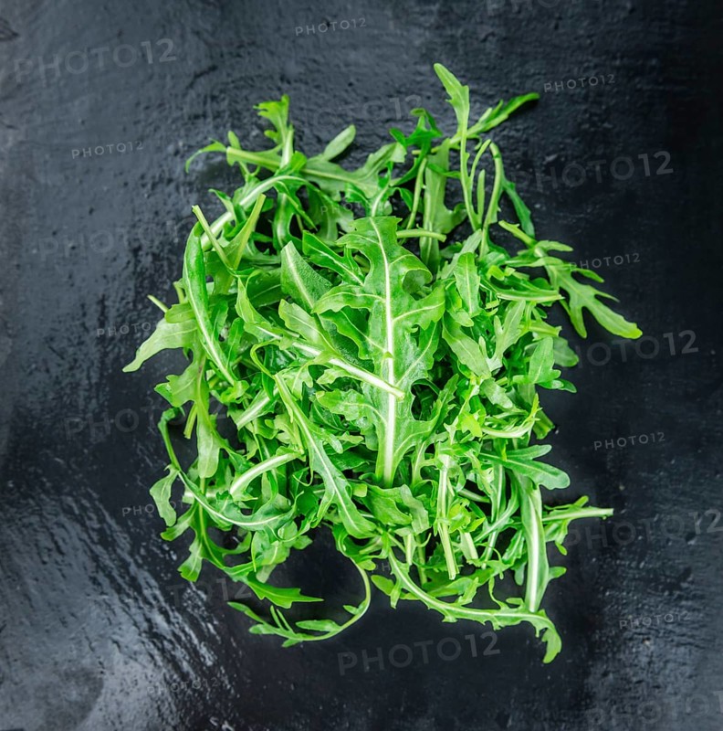 Portion of fresh Arugula (detailed close-up shot, selective focus)