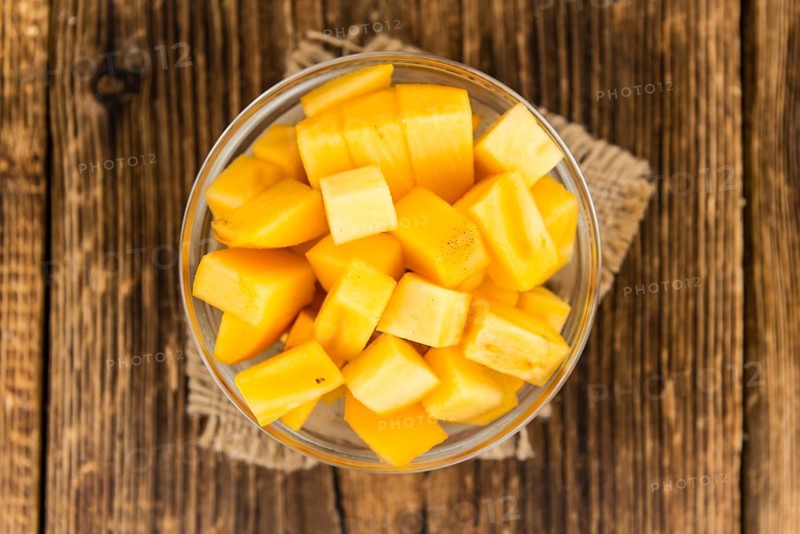 Portion of fresh made Kaki fruits (close-up shot, selective focus)