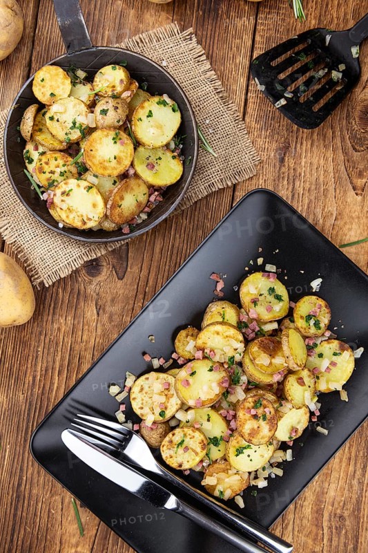 Portion of fresh made Fried Potatoes (selective focus, close-up)