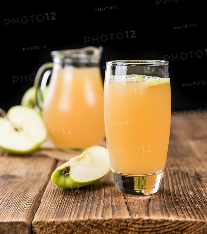 Fresh made Juice (apple) on a vintage background (close-up shot)