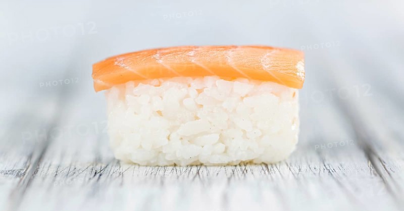 Portion of Sushi on a wooden table (selective focus, close-up shot)