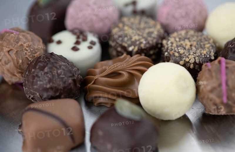 Portion of mixed Pralines as detailed close-up shot