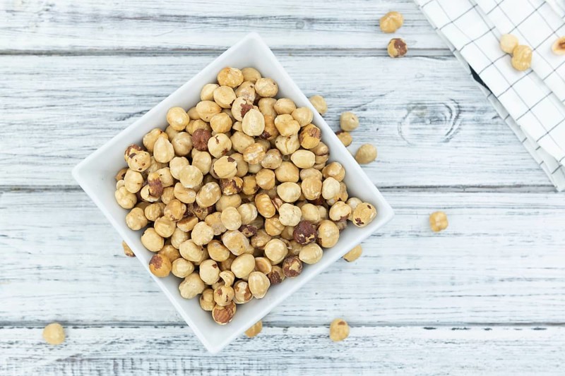 Peeled Hazelnuts as detailed close up shot (selective focus)