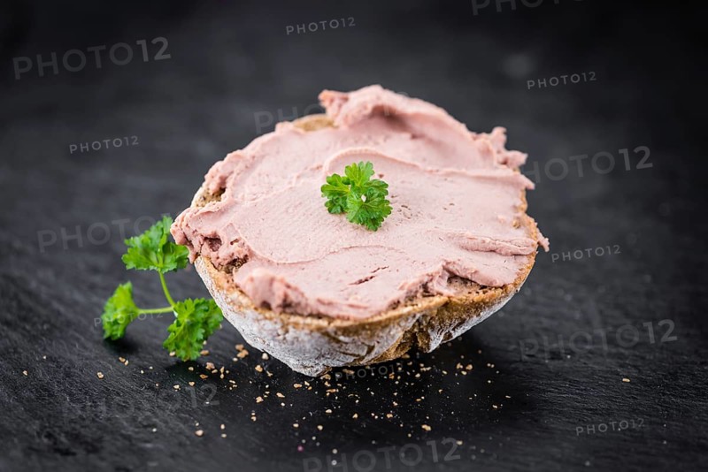 Liverwurst Sandwich on a vintage background as detailed close-up shot (selective focus)