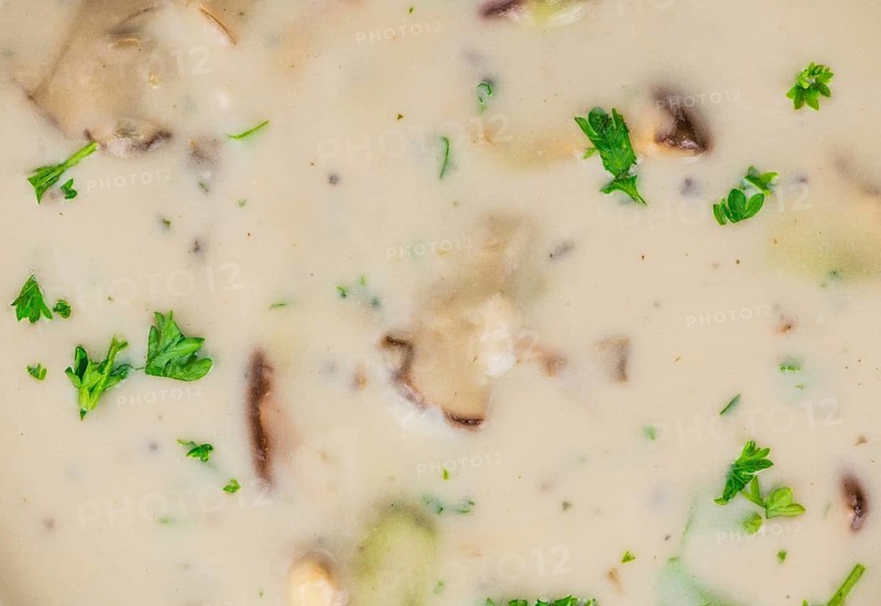 Homemade Porcini Soup on vintage background selective focus, close-up shot