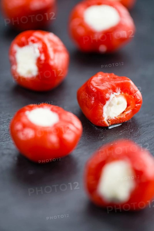 Homemade Filled Pimientos on vintage background (selective focus, close-up shot)
