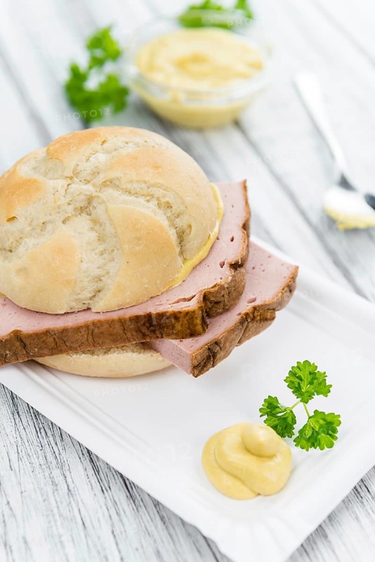 Leberkaese on a vintage background as detailed close-up shot (selective focus)