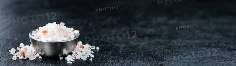 Pink Salt on a vintage background as detailed close-up shot (selective focus)