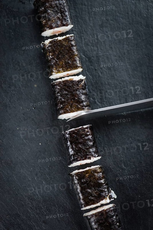 Slate slab with some Sushi (selective focus, close-up shot)