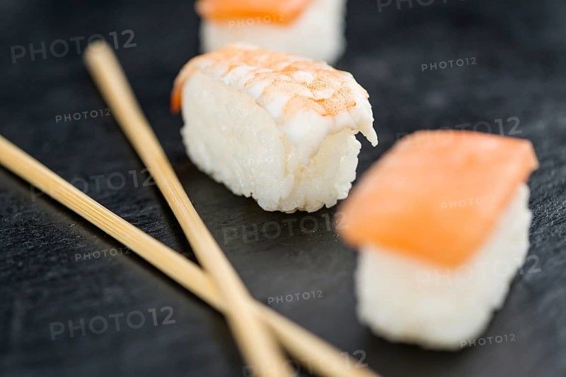 Slate slab with some Sushi (selective focus, close-up shot)