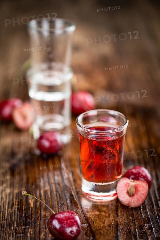 Some homemade Cherry Liqueur as detailed close-up shot, selective focus