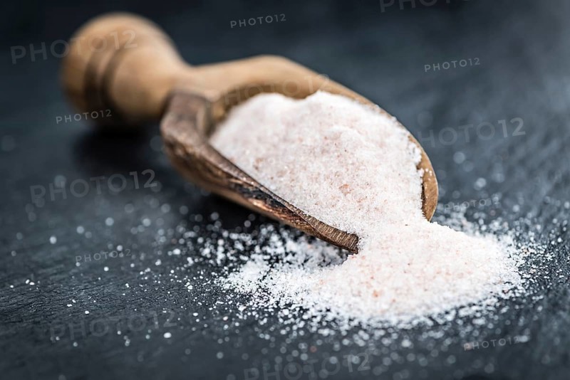 Portion of Himalayan Salt on a rustic slate slab (selective focus, close-up shot)