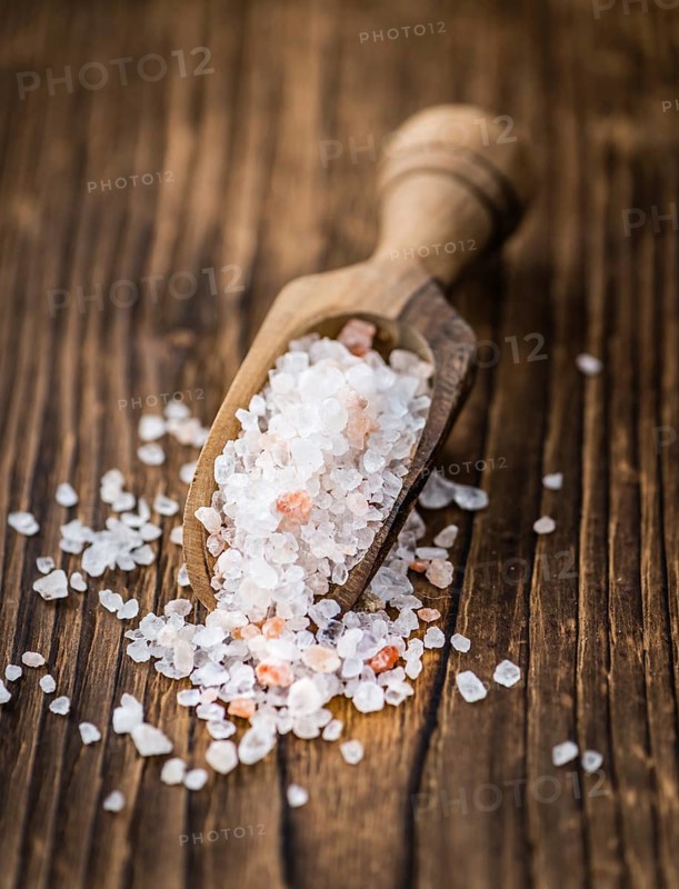 Pink Salt on a vintage background as detailed close-up shot (selective focus)