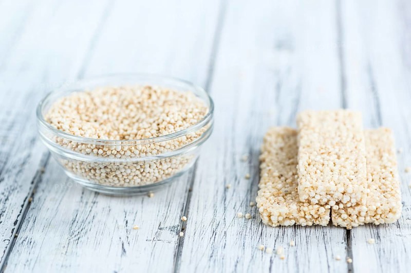 Some fresh made Quinoa Bars on vintage background (close-up shot)