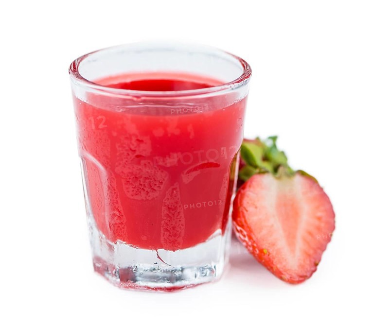 Strawberry liqueur isolated on white background, selective focus, close-up shot