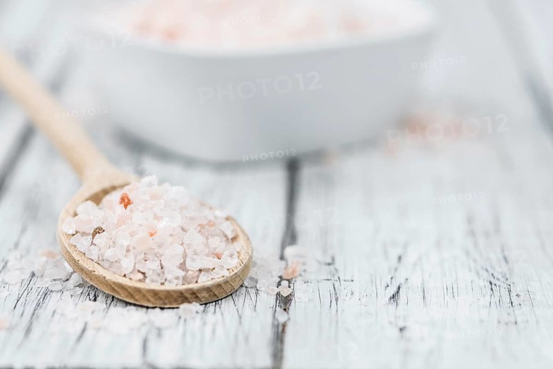 Pink Salt on a vintage background as detailed close-up shot (selective focus)
