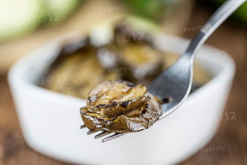 Homemade Antipasti (Grilled Zucchinis) on vintage background (selective focus, close-up shot)