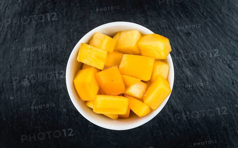 Portion of fresh made Kaki fruits (close-up shot, selective focus)