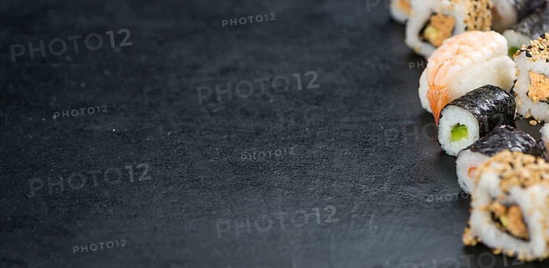 Portion of fresh made Sushi (detailed close-up shot, selective focus)