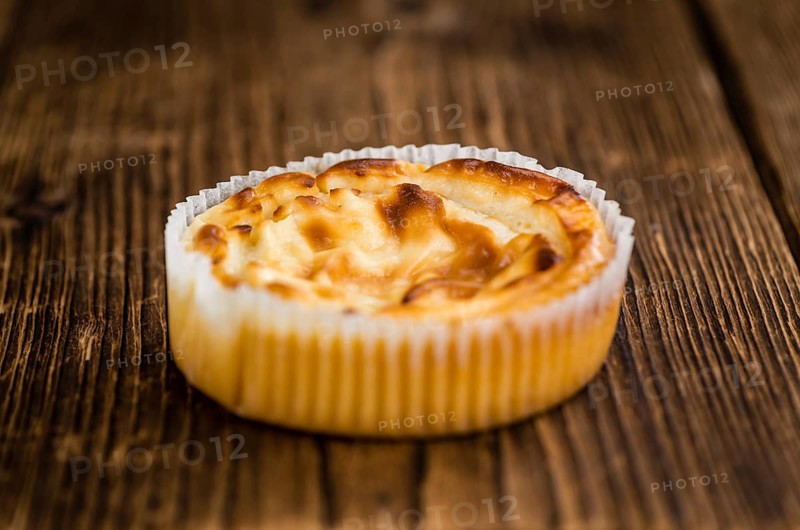 Homemade Cheesecake on an wooden table (selective focus) as detailed close-up shot