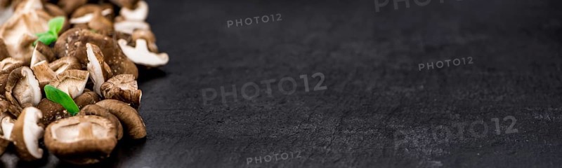 Portion of fresh Shiitake mushrooms close-up shot, selective focus