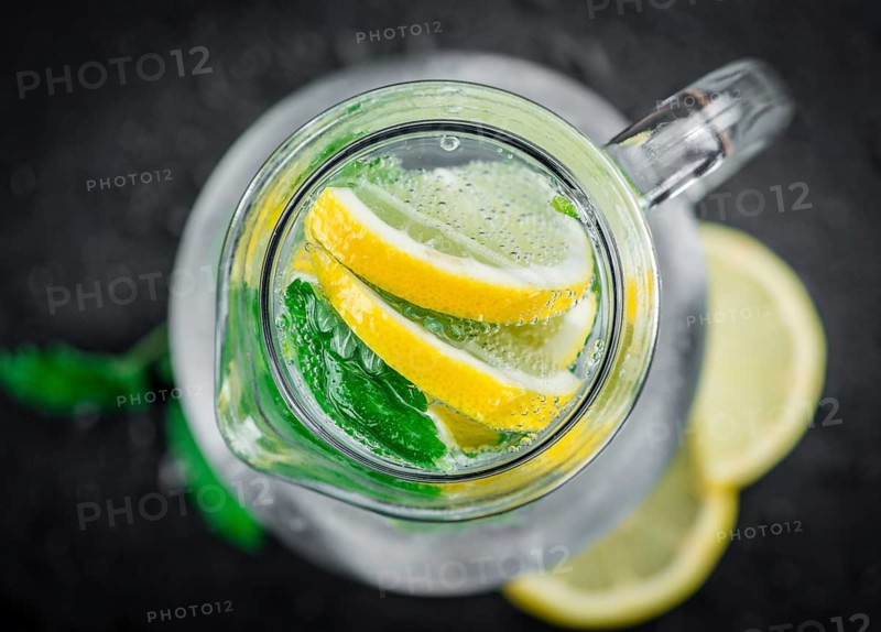 Some Lemonade (with Balm) on a slate slab (close-up shot, selective focus)