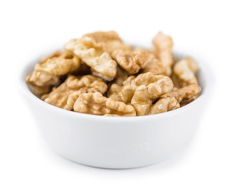 Walnuts (kernels) isolated on white background (selective focus, close-up shot)