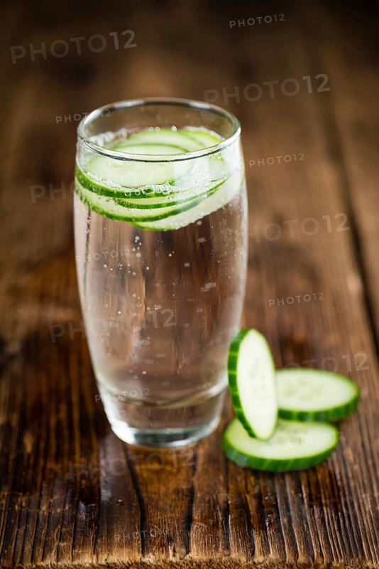 Cucumber Water on a vintage background as detailed close-up shot, selective focus