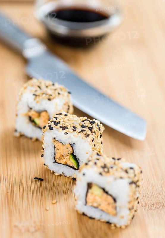 Portion of Sushi on a wooden table (selective focus, close-up shot)