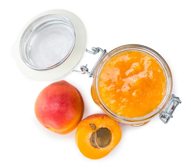 Portion of fresh made Apricot Jam isolated on white background