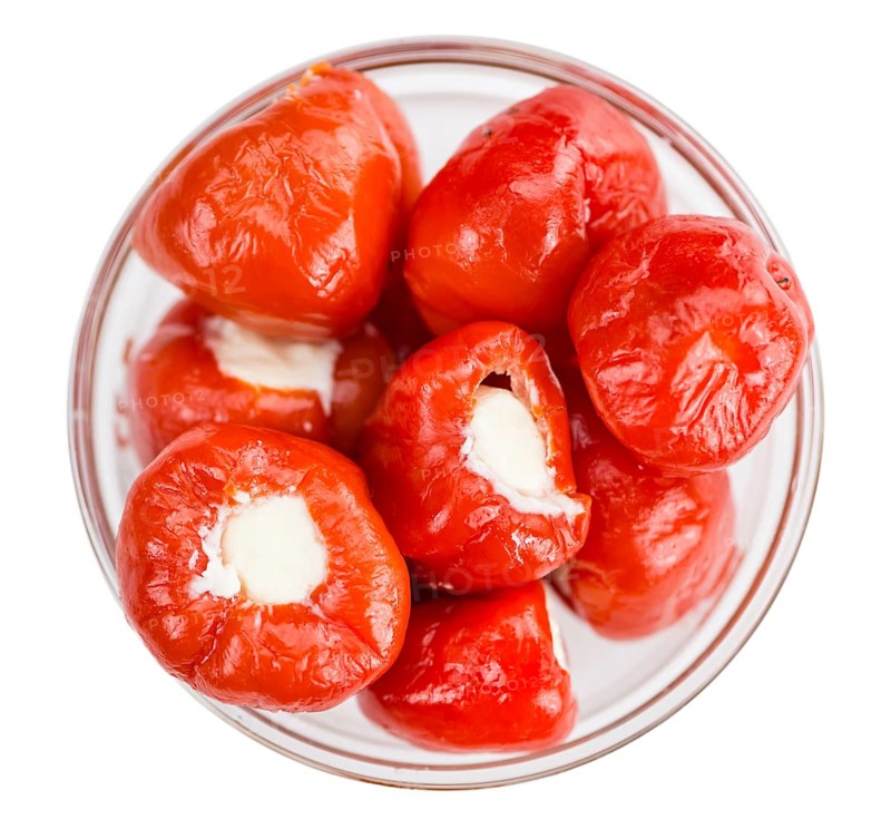 Fresh made Red Pepper (stuffed with cheese) isolated on white background (close-up shot)