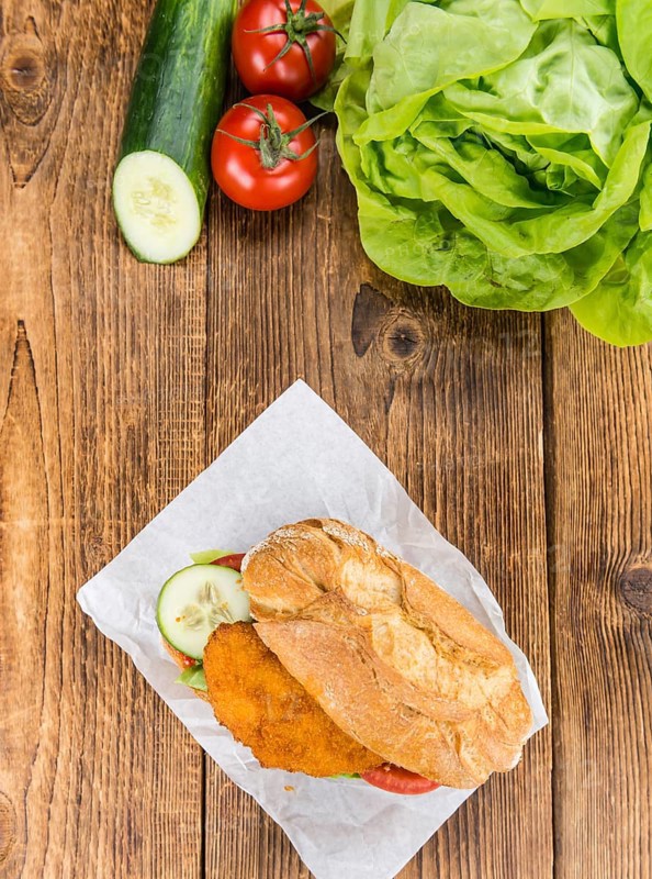 Chicken Schnitzel on a bun (selective focus, detailed close-up shot)
