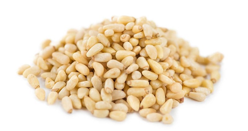 Pine Nuts isolated on white background (selective focus, close-up shot)
