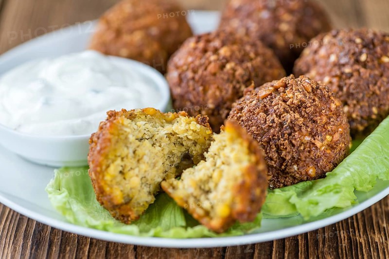 Homemade Falafel (close-up shot, selective focus) on wooden background