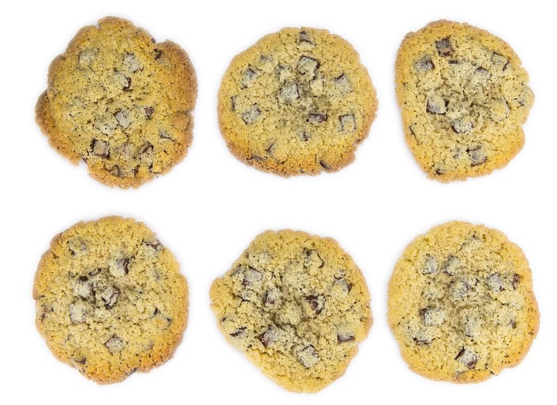 Chocolate Chip Cookies as detailed close-up shot isolated on white background (selective focus)
