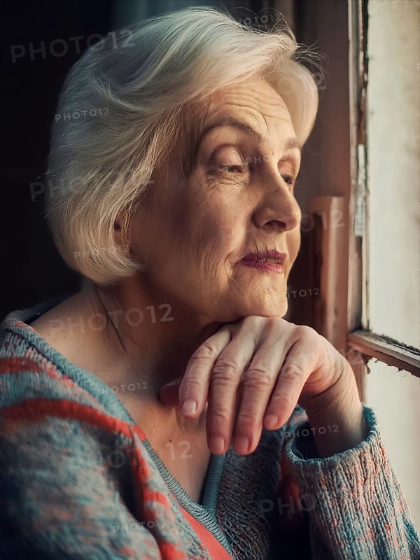 An elderly woman sits in her old flat and looks bored out of the window, loneliness, poverty in old age, AI generated, AI generated