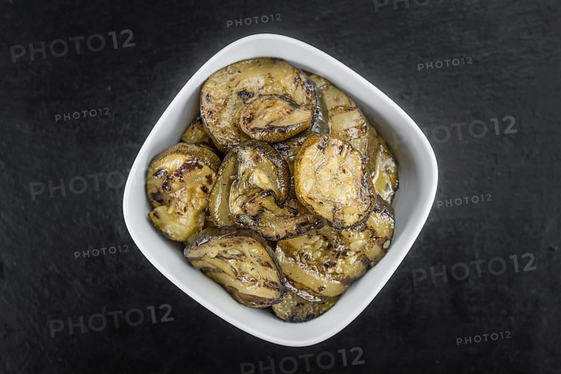 Homemade Antipasti (Grilled Zucchinis) on vintage background (selective focus, close-up shot)