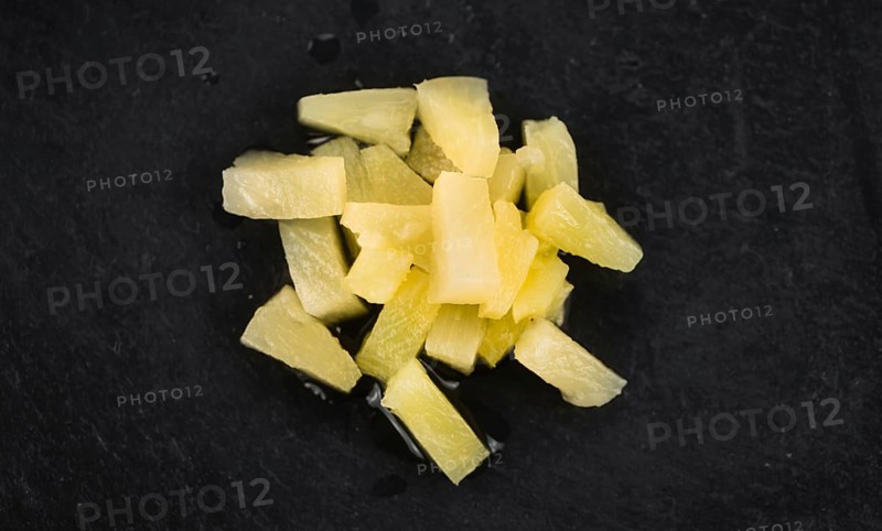 Portion of fresh Preserved Pineapple pieces close-up shot, selective focus