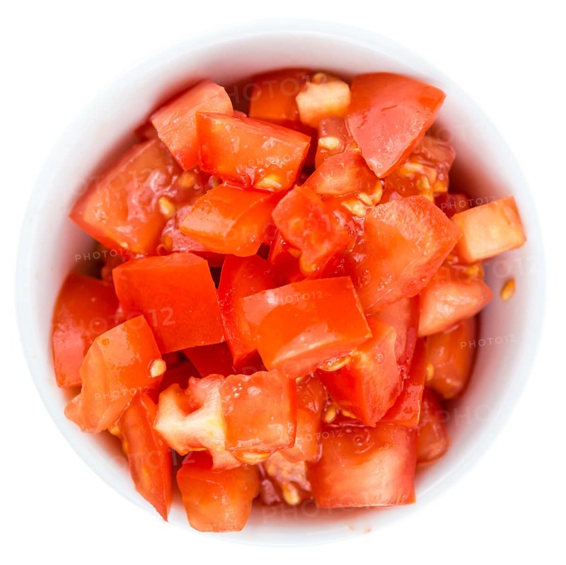 Portion of Diced Tomatoes (as close-up shot) isolated on white background