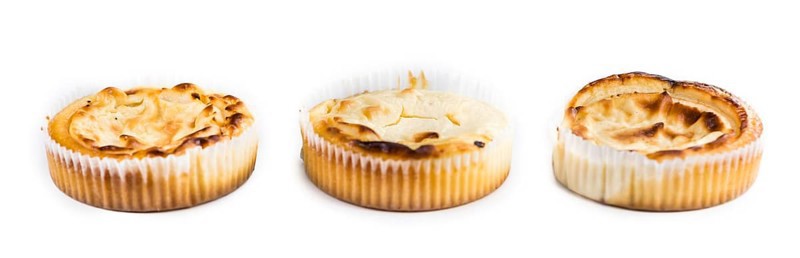 Fresh made Mini Cheesecake isolated on white background (close-up shot)