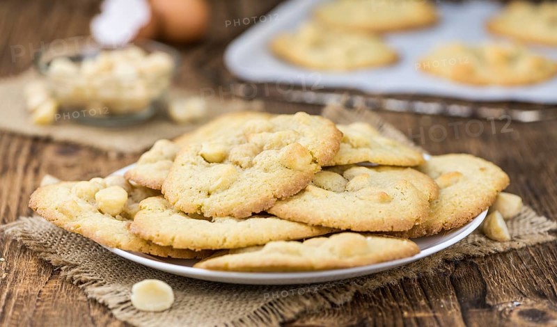 Vintage wooden table with Cookies (selective focus, close-up shot)